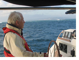 Doug Ruttan behind the wheel crossing Wide Bay Bar